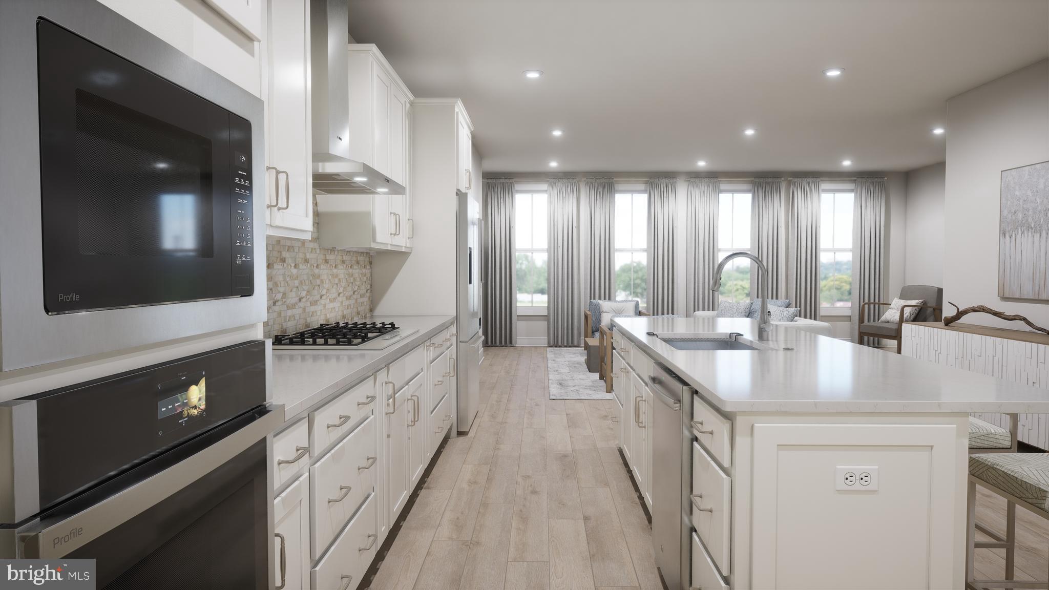 44476 Lowestoft Square Ashburn, VA 20147 - Photo 5 of 27 a large kitchen with stainless steel appliances a sink and counter space