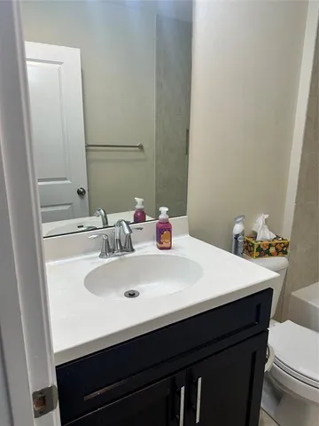 a bathroom with a sink and a toilet