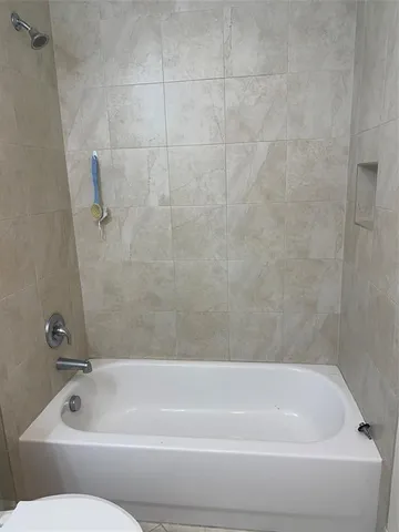 a bathroom with a bath tub