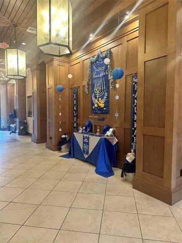 a living room with furniture and flowers