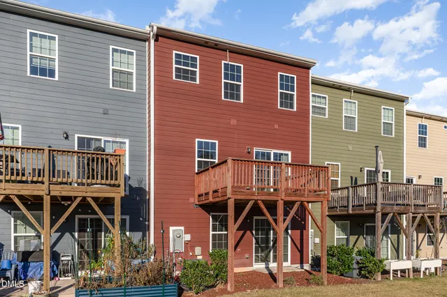 a view of residential houses with street