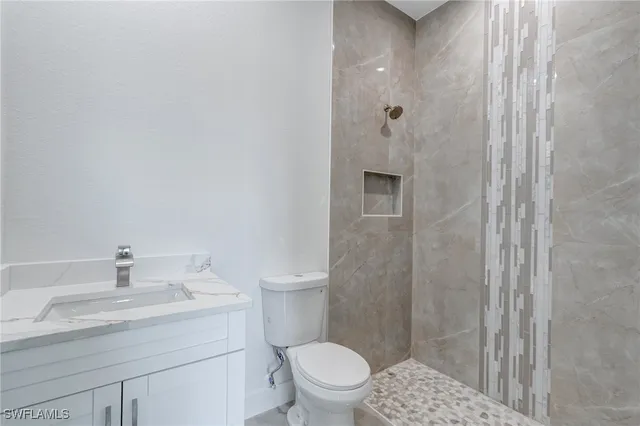 a view of a house with porch and garden