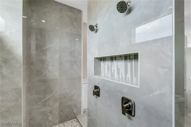 a bedroom with bed and a potted plant