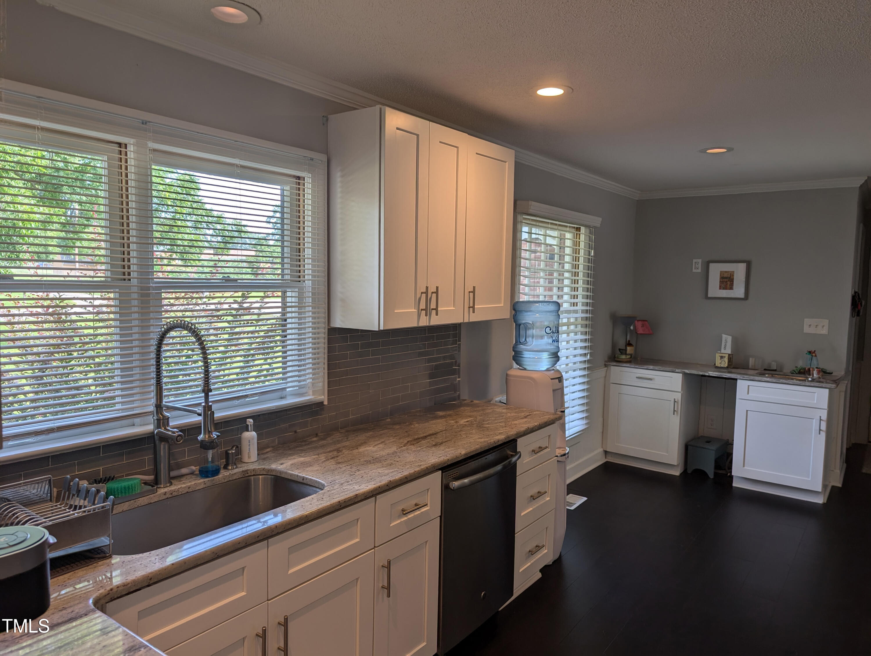 4008 Brown Place Raleigh, NC 27604 - Photo 2 of 14 a kitchen that has a sink and a stove in it