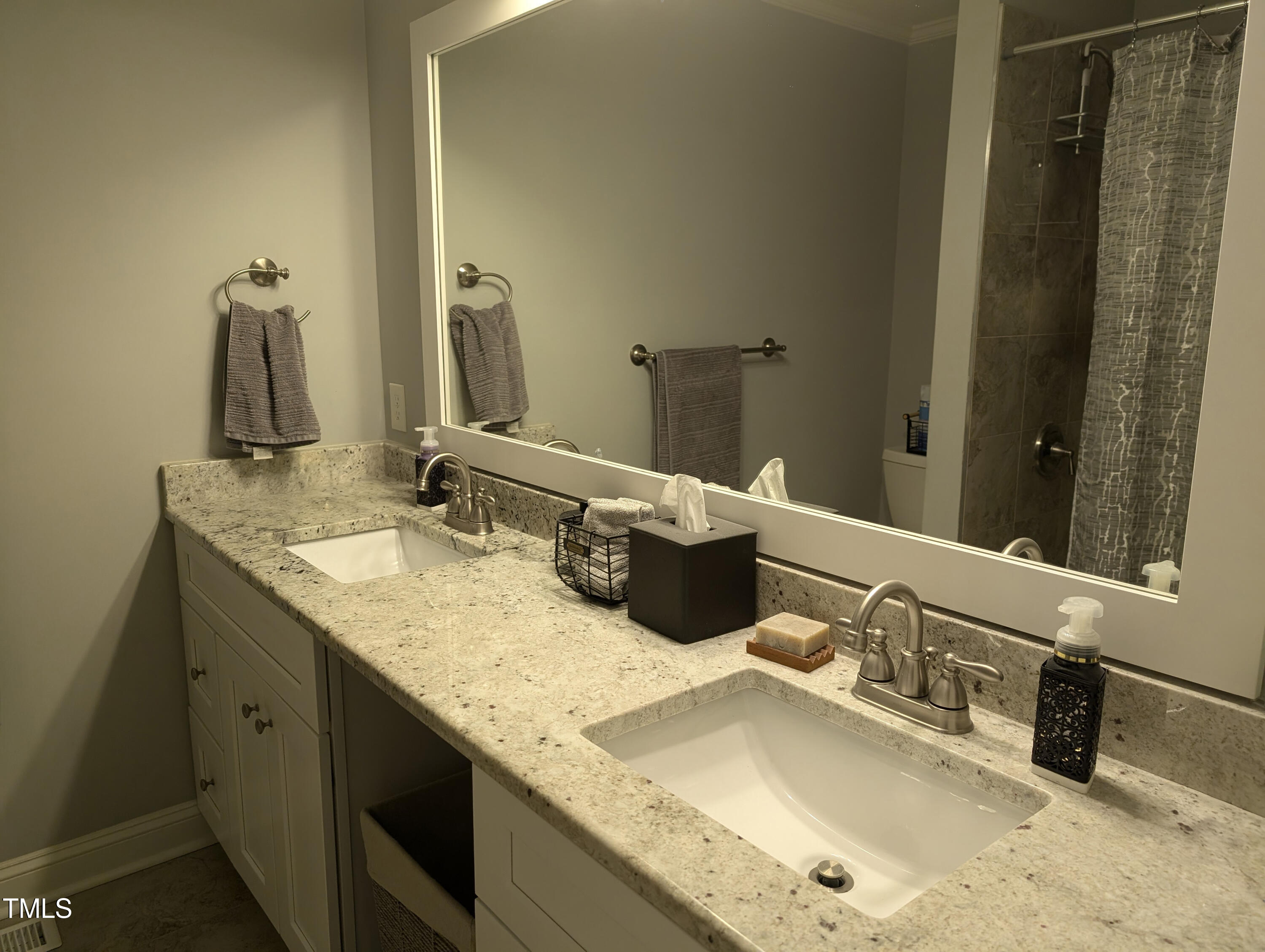 4008 Brown Place Raleigh, NC 27604 - Photo 9 of 14 a bathroom with a granite countertop sink and a mirror