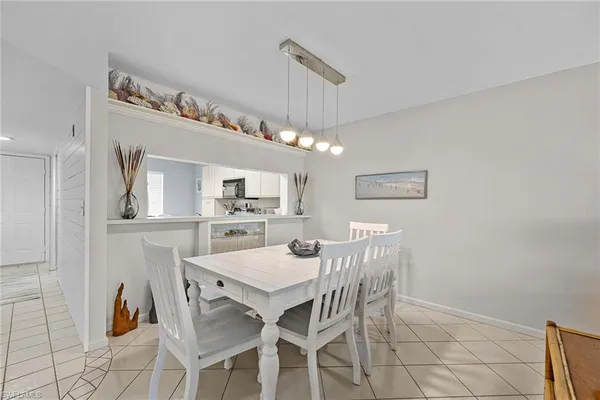 a kitchen with a sink a stove and cabinets