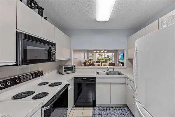 a kitchen with a stove and a microwave