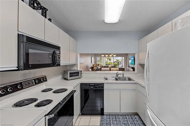 a kitchen with a stove and a microwave