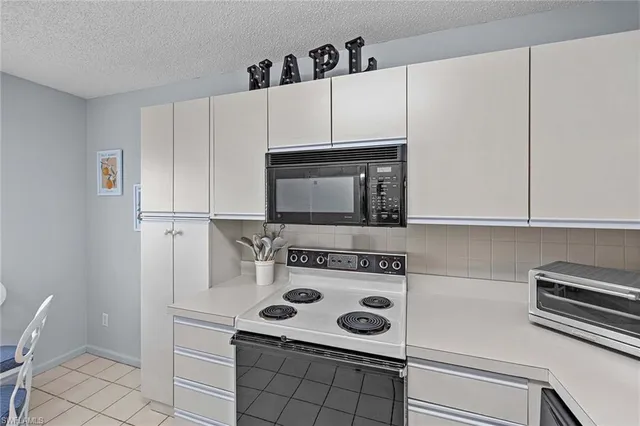a view of a dining room that has a table and a chair