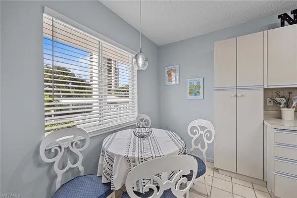 a bedroom with bed and a window