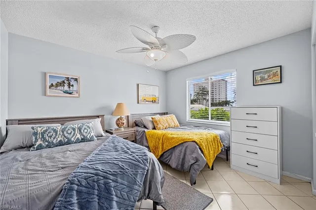 a view of a swimming pool with outdoor seating and plants