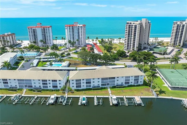 a view of a swimming pool with lawn chairs