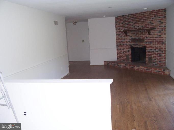 1205 Peachtree Road Fallston, MD 21047 - Photo 4 of 10 a living room with a fireplace