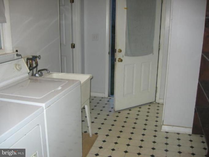 1205 Peachtree Road Fallston, MD 21047 - Photo 8 of 10 a bathroom with a sink a toilet and a shower