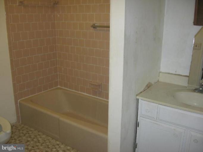 1205 Peachtree Road Fallston, MD 21047 - Photo 9 of 10 a white bath tub sitting next to a white sink