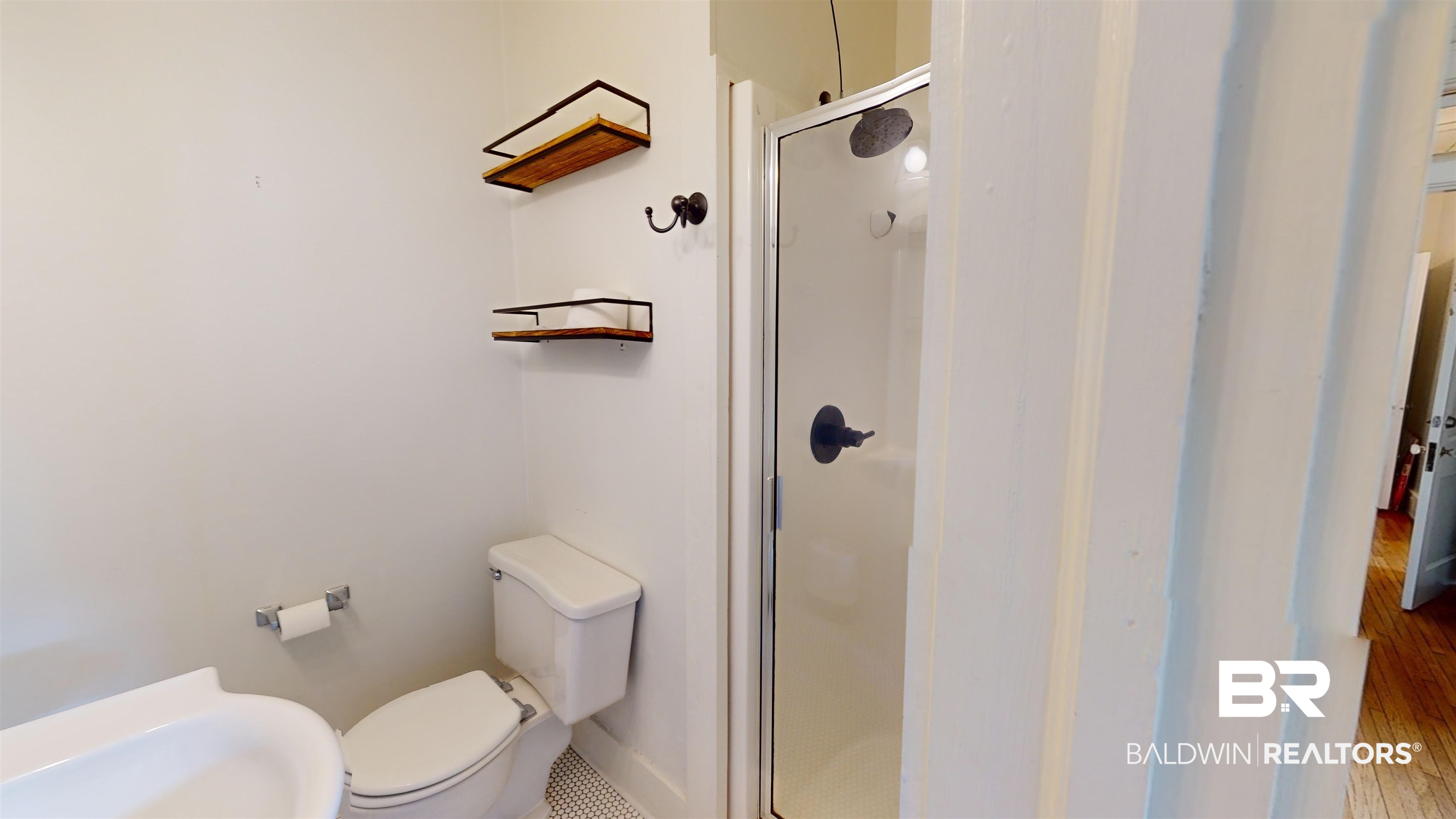 4307 Stein Street Mobile, AL 36608 - Photo 20 of 28 Bathroom featuring walk in shower, hardwood / wood-style flooring, and toilet