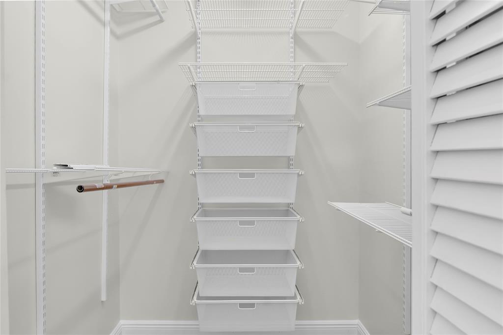 7801 Courtyard Run West Boca Raton, FL 33433 - Photo 16 of 31 a view of walk in closet with empty racks