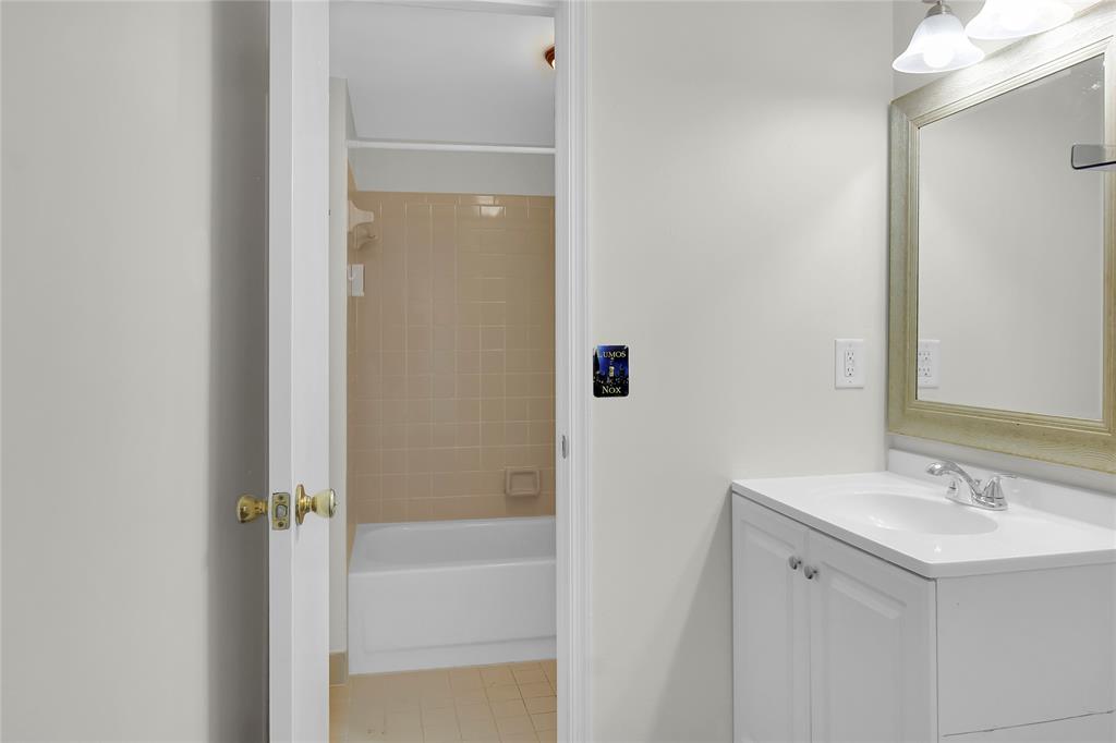 7801 Courtyard Run West Boca Raton, FL 33433 - Photo 23 of 31 a bathroom with a sink mirror and shower