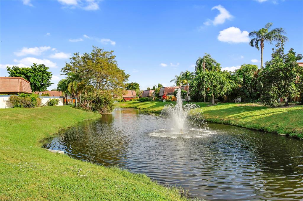 7801 Courtyard Run West Boca Raton, FL 33433 - Photo 29 of 31 a view of a lake with a yard