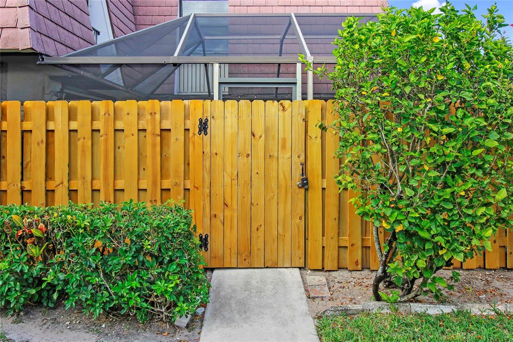 7801 Courtyard Run West Boca Raton, FL 33433 - Photo 3 of 31 a view of a backyard with potted plants