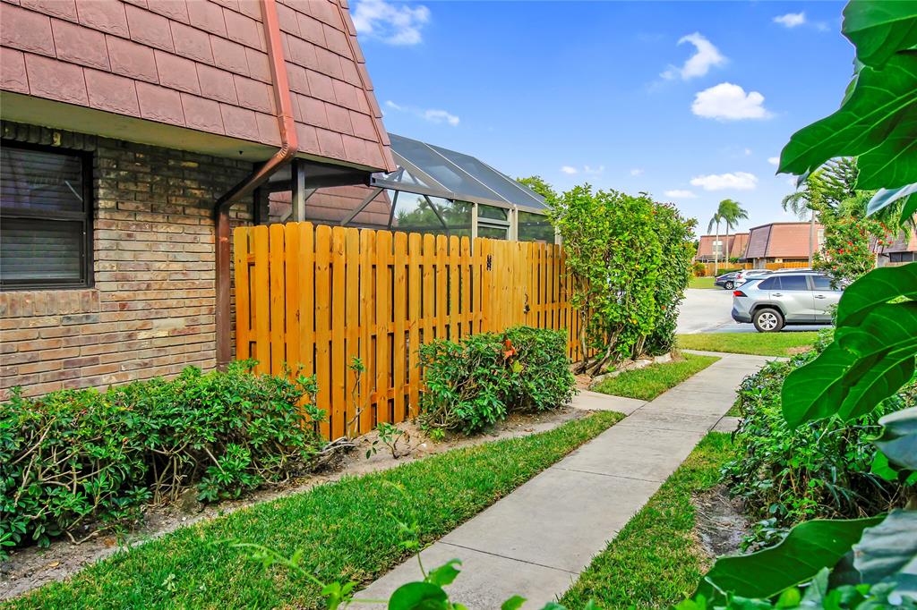 7801 Courtyard Run West Boca Raton, FL 33433 - Photo 5 of 31 a view of a backyard with potted plants