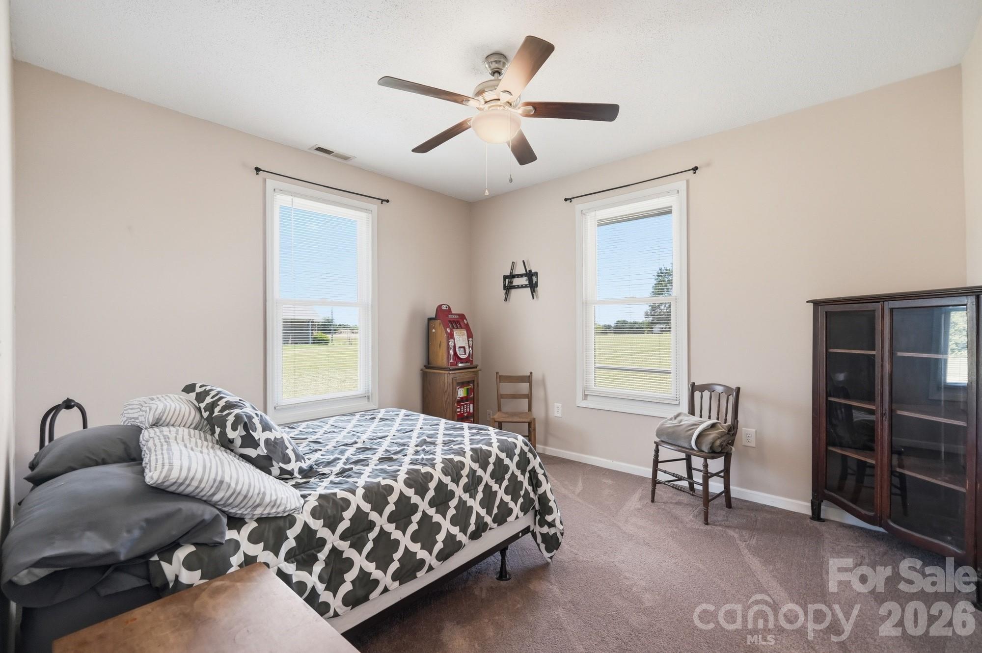 4415 Old Monroe Marshville Road Wingate, NC 28174 - Photo 17 of 28 a bedroom with furniture and windows