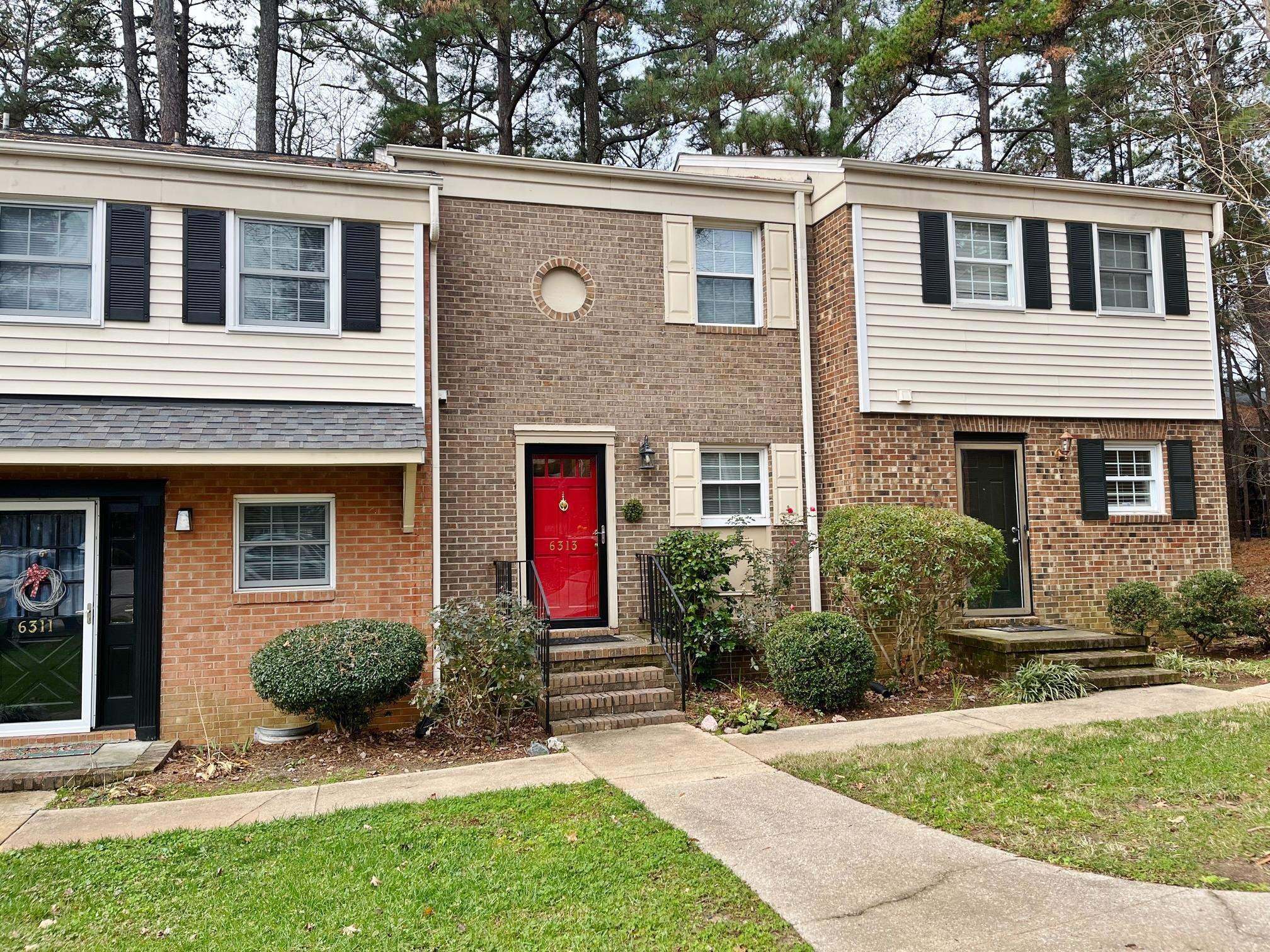 6313 New Market Way, Unit 6313 Raleigh, NC 27615 - Photo 1 of 18 front view of a house with a yard