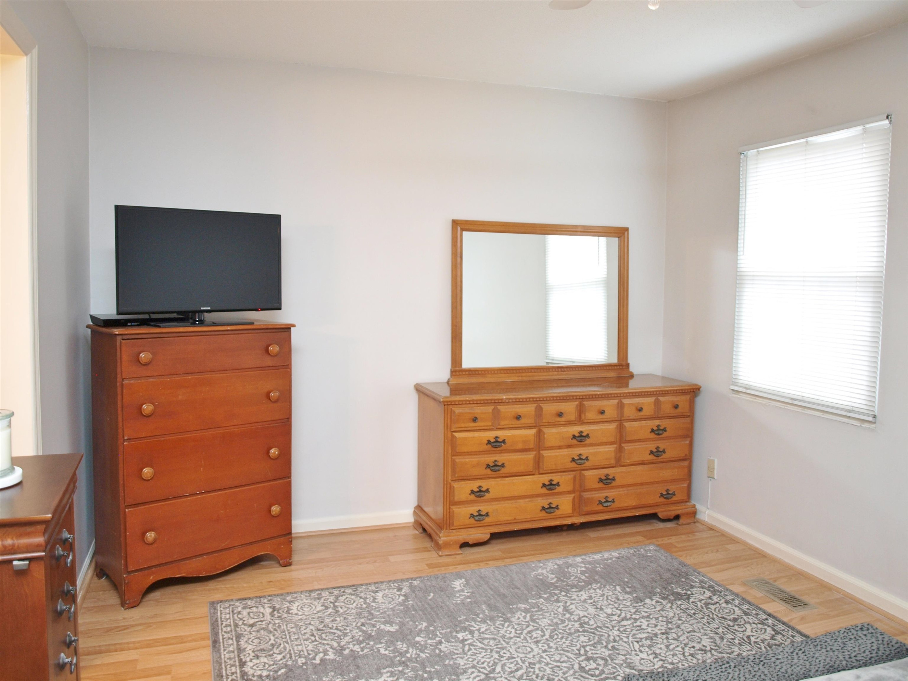 6313 New Market Way, Unit 6313 Raleigh, NC 27615 - Photo 15 of 18 a view of room with furniture and flat screen tv
