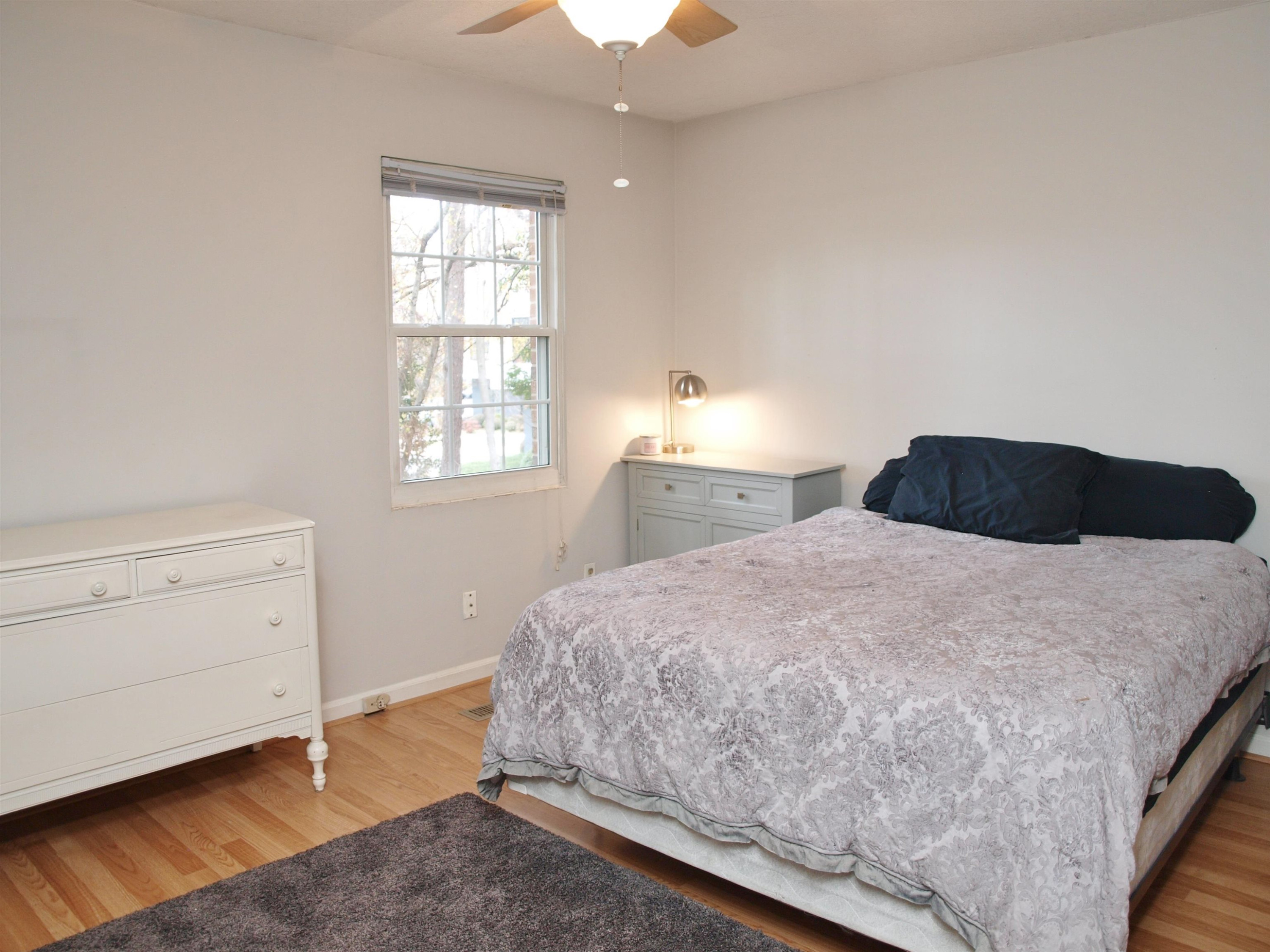 6313 New Market Way, Unit 6313 Raleigh, NC 27615 - Photo 16 of 18 a bedroom with a bed and a window