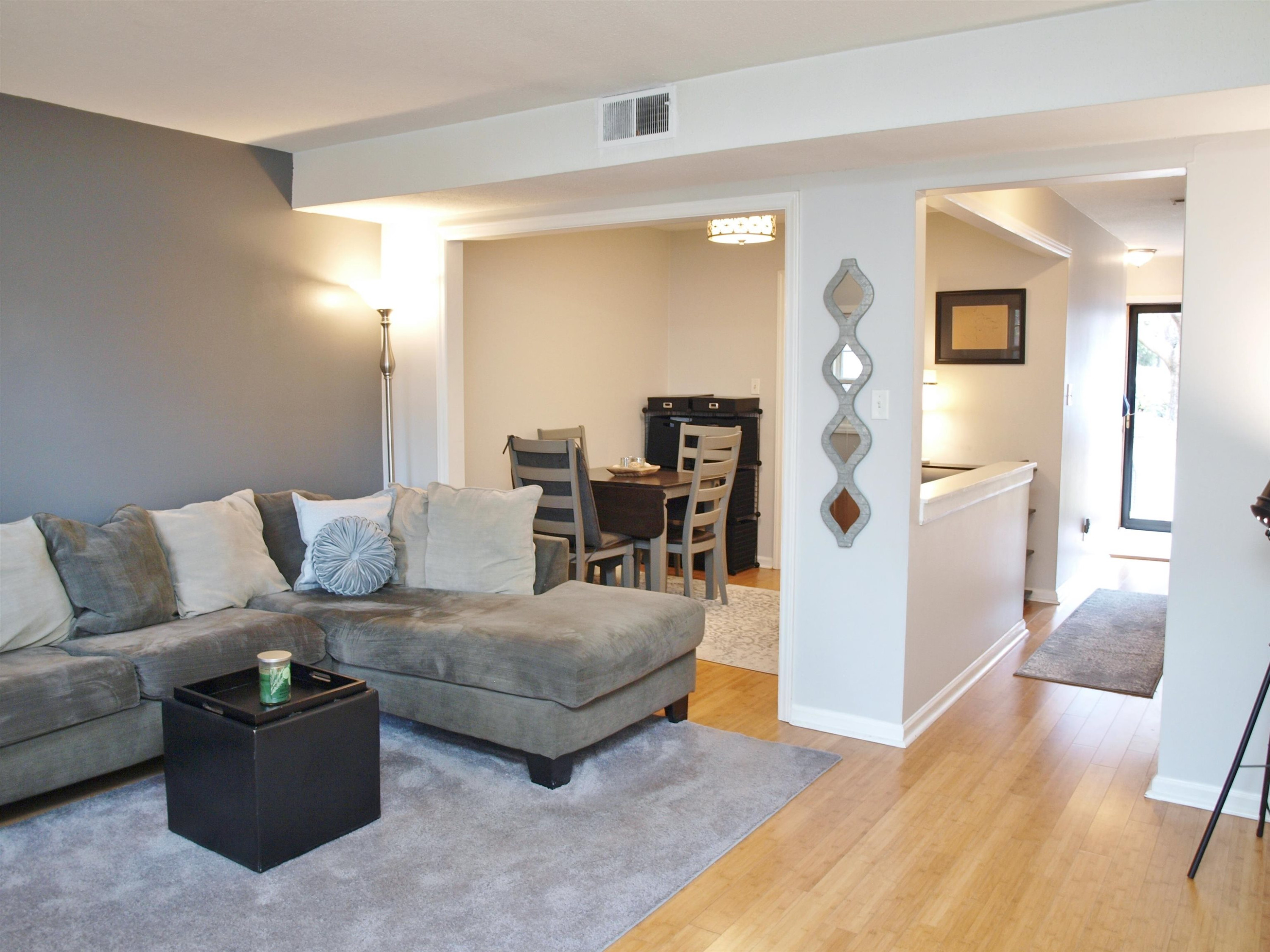 6313 New Market Way, Unit 6313 Raleigh, NC 27615 - Photo 4 of 18 a living room with furniture and wooden floor