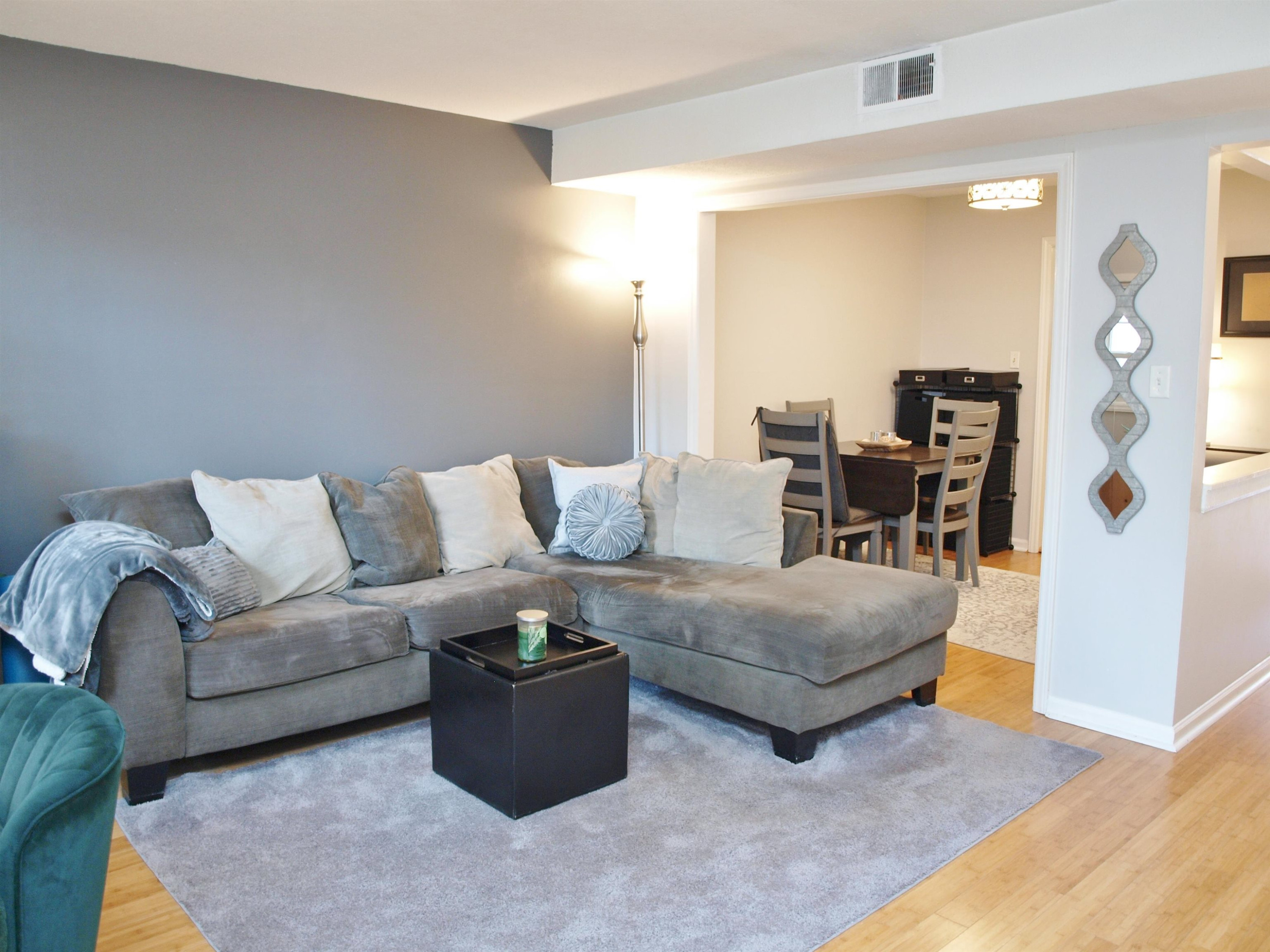 6313 New Market Way, Unit 6313 Raleigh, NC 27615 - Photo 5 of 18 a living room with furniture and wooden floor