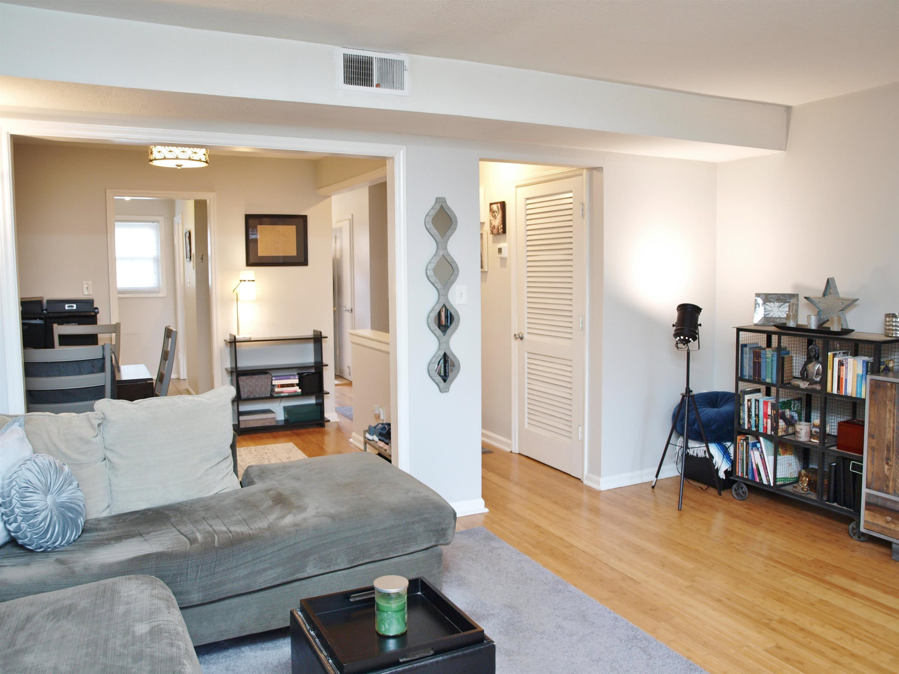 6313 New Market Way, Unit 6313 Raleigh, NC 27615 - Photo 7 of 18 a living room with furniture and a wooden floor