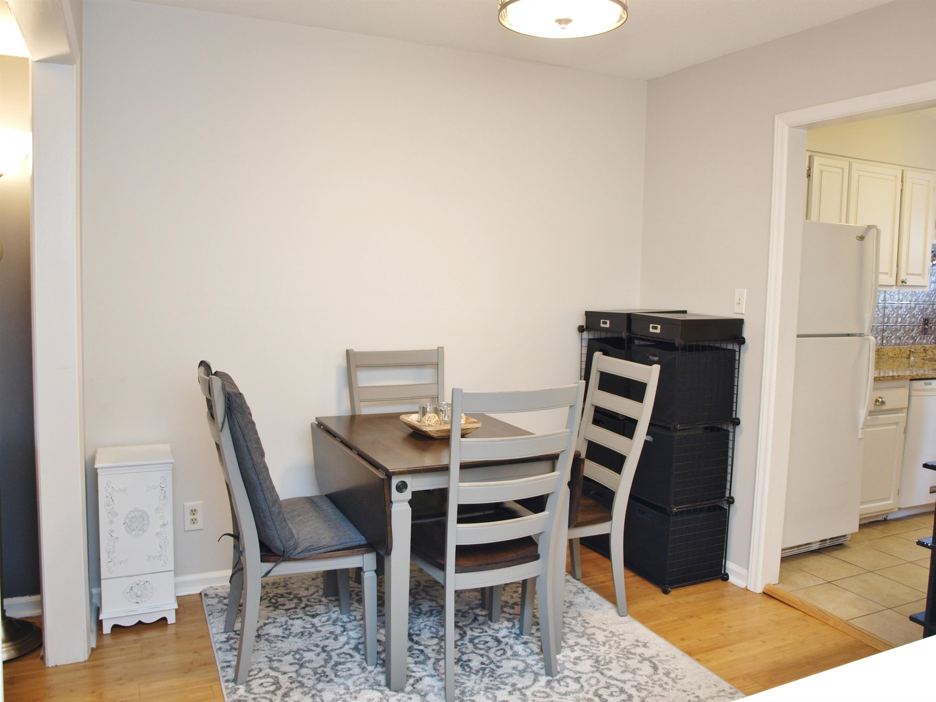 6313 New Market Way, Unit 6313 Raleigh, NC 27615 - Photo 8 of 18 a dining room with a table and chairs