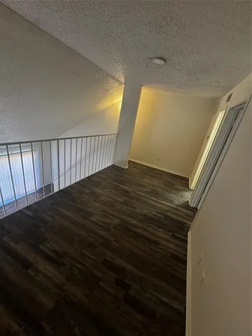 a view of a balcony with chairs