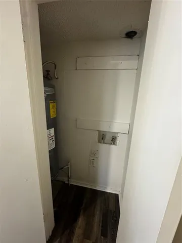 a bathroom with a granite countertop sink a toilet and shower