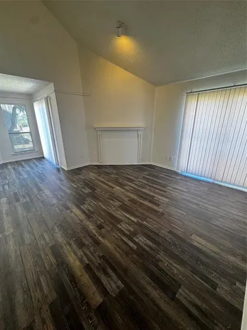 a view of a livingroom with wooden floor