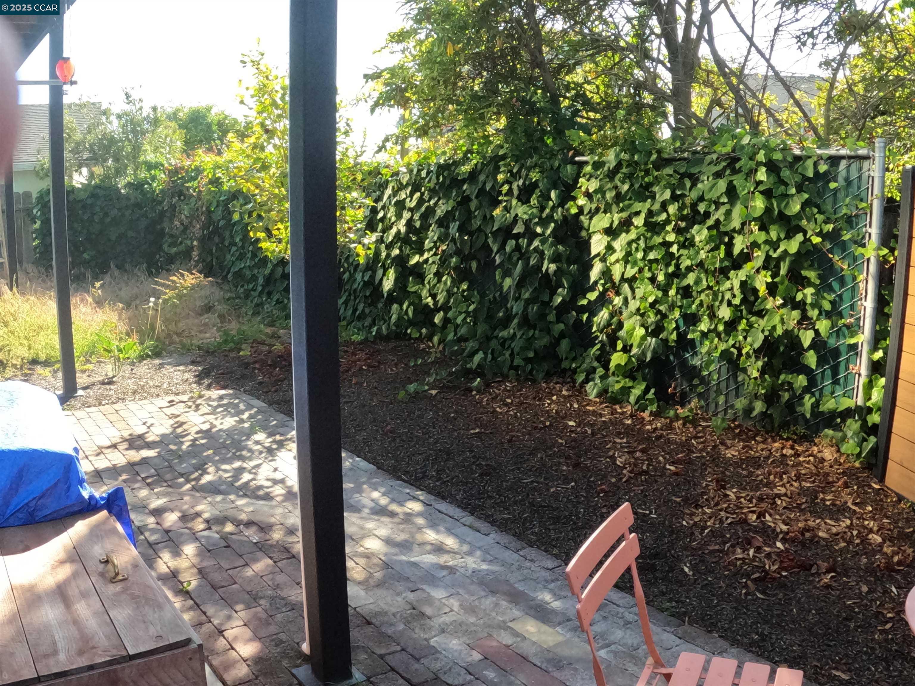 1329 Hopkins Street, Unit D Berkeley, CA 94702 - Photo 14 of 16 a view of a porch with a yard