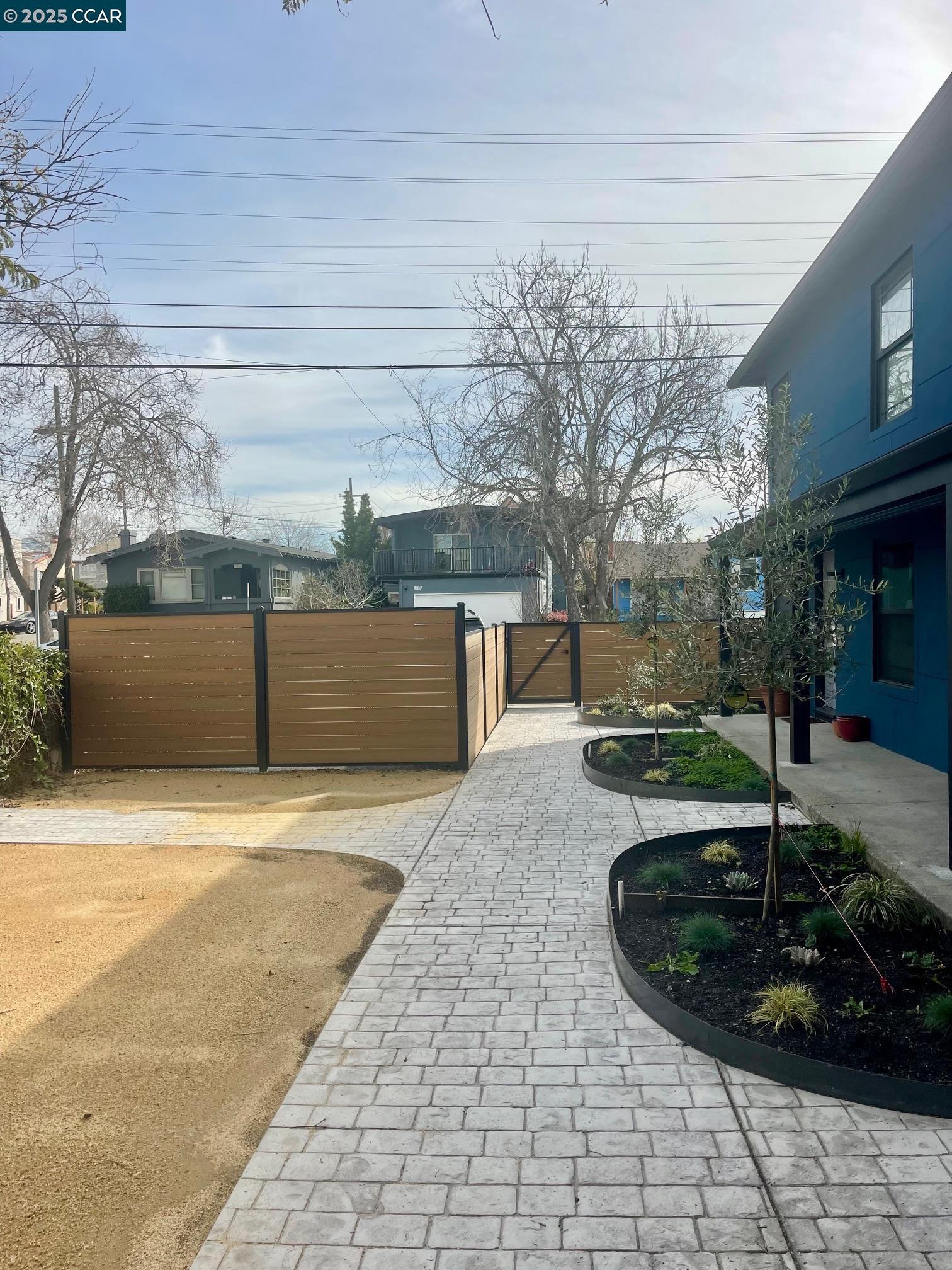 1329 Hopkins Street, Unit D Berkeley, CA 94702 - Photo 2 of 16 a view of a backyard with pathway