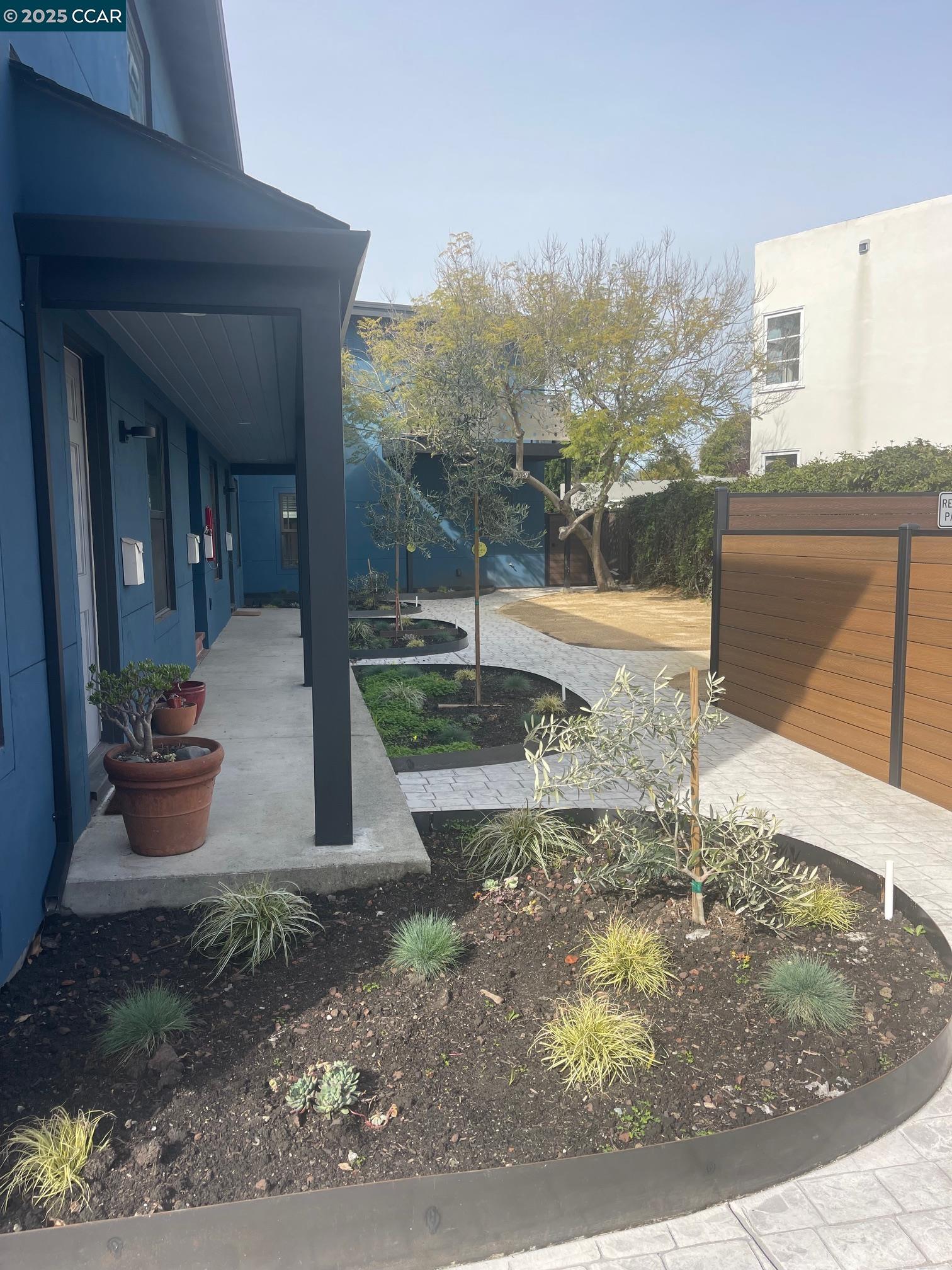 1329 Hopkins Street, Unit D Berkeley, CA 94702 - Photo 3 of 16 a view of a house with a backyard