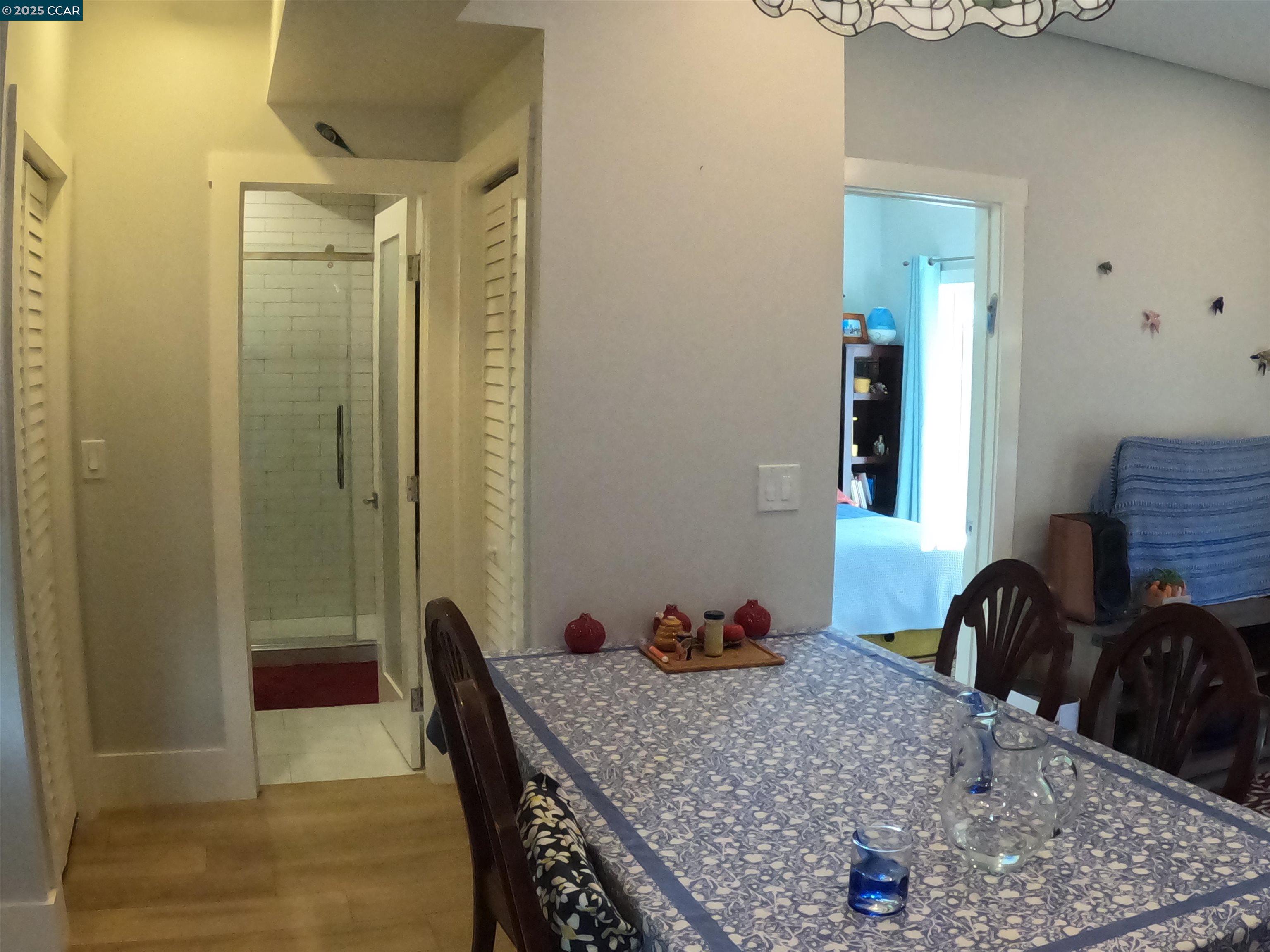 1329 Hopkins Street, Unit D Berkeley, CA 94702 - Photo 6 of 16 a room with a table and chairs