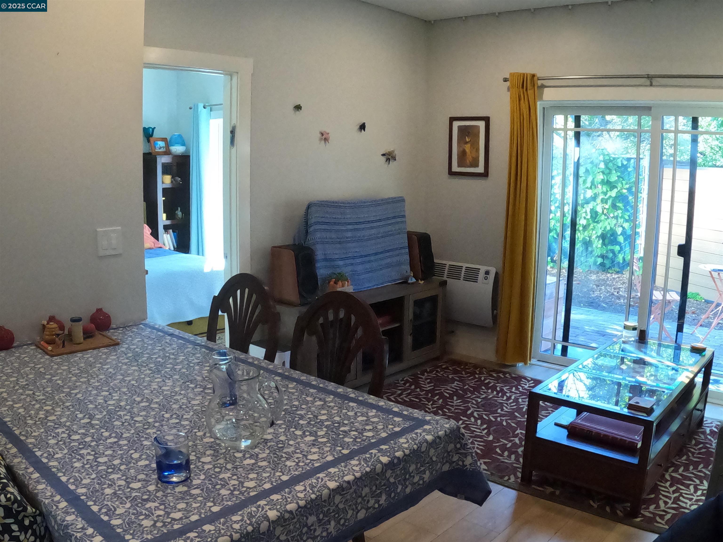 1329 Hopkins Street, Unit D Berkeley, CA 94702 - Photo 7 of 16 a room with furniture and a large window