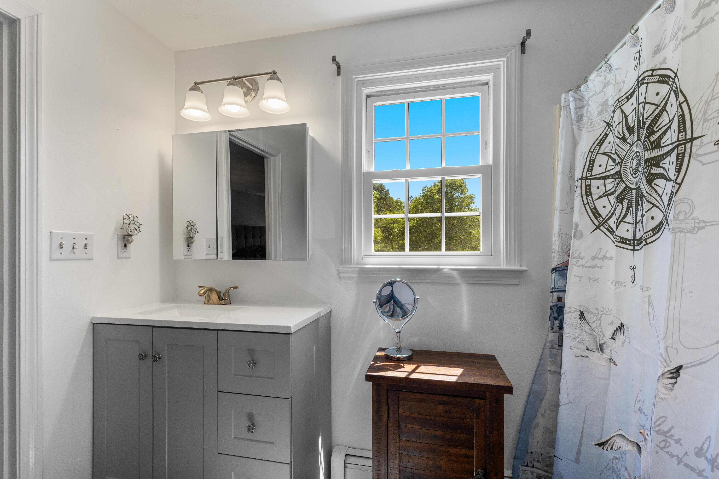 30 Sheffield Place Mashpee, MA 02649 - Photo 21 of 38 a bathroom with a sink and a mirror