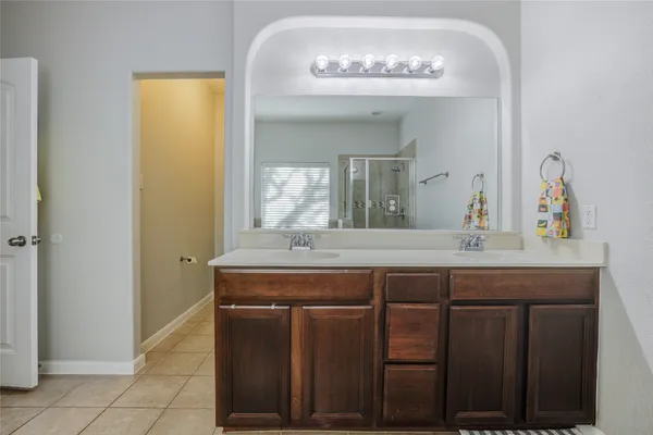 a kitchen with a stove a refrigerator and a sink