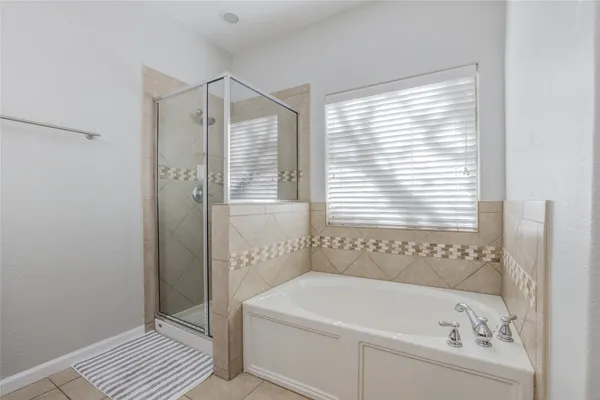 a kitchen with kitchen island granite countertop a stove top oven microwave and refrigerator