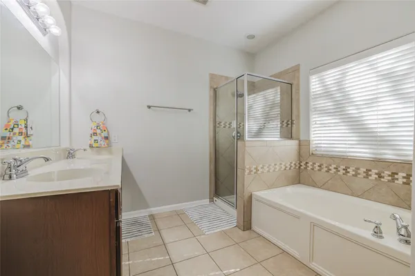 a kitchen with sink and refrigerator