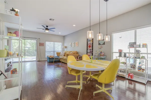 a view of kitchen and dining room with wooden floor