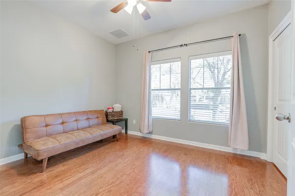 a bathroom with a sink a toilet and shower curtain