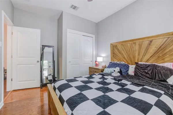 a bedroom with furniture and a window