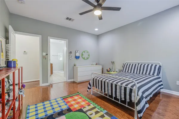 a spacious bathroom with a granite countertop sink a mirror and a vanity