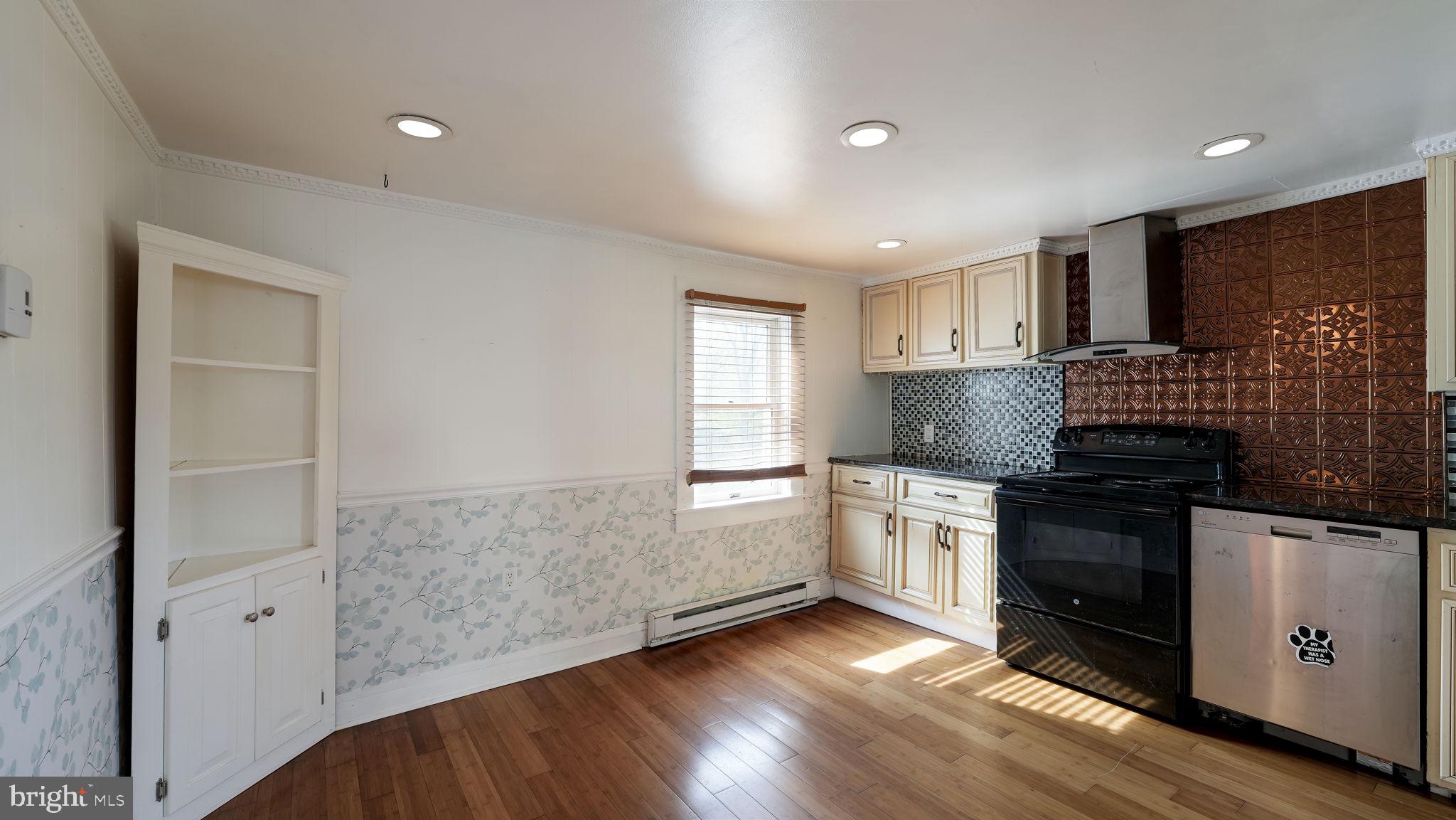 165 West Street Souderton, PA 18964 - Photo 11 of 31 a kitchen with granite countertop white cabinets and white appliances